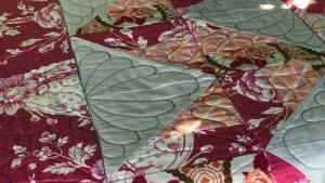 Quilted feathers on a table runner